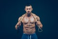 Muscular man skipping rope. Portrait of muscular