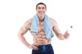 Muscular man smiling with blue towel over neck, drinking water, isolated on white background