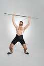 Strong powerlifter lifting with effort unheavy barbell. Royalty Free Stock Photo