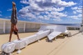 Muscular man standing on huge anchor on the bow of Cruise ship Royalty Free Stock Photo