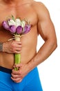 Muscular man with tulips