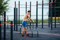 Muscular man warming up before exercise at crossfit ground doing push ups as part of training. Sport concept Royalty Free Stock Photo