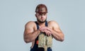 muscular man worker in engineer boilersuit and protective hard hat hold shovel, labor day