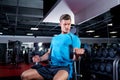 Muscular man working out with dumbbells in gym. Royalty Free Stock Photo