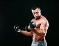 Muscular man working out with dumbbells Royalty Free Stock Photo