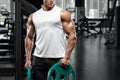 Muscular man working out in gym doing exercise, strong male bodybuilder Royalty Free Stock Photo