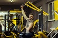Muscular man working out in gym doing exercises Royalty Free Stock Photo