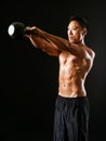 Muscular man working out with kettle bell Royalty Free Stock Photo