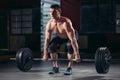 Muscular man workout with barbell at gym Royalty Free Stock Photo
