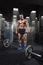 Muscular man workout with barbell at gym. Deadlift barbells work