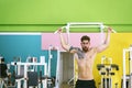 Muscular man workout doing pull ups on bar in gym,Man working out in a fitness club Royalty Free Stock Photo