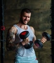 Muscular man workout in the gym. Athletic man having weight training in gym. Handsome man with strong muscles workout in Royalty Free Stock Photo