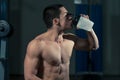 Muscular Men Drinking Water From Shaker Royalty Free Stock Photo
