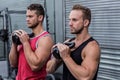 Muscular men exercising with kettlebells Royalty Free Stock Photo