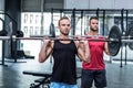 Muscular men lifting a barbell Royalty Free Stock Photo