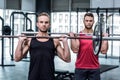 Muscular men lifting a barbell Royalty Free Stock Photo