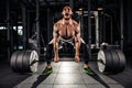 Muscular men lifting deadlift