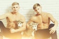 Muscular men twins with body, husky dogs, puppy pets