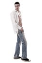 A muscular model in a white open shirt and jean