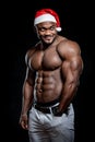 Muscular naked santa claus posing for camera Royalty Free Stock Photo