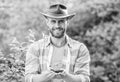 Muscular ranch man in cowboy hat care plants. Eco farm worker. Earth day. happy earth day. Eco living. farming and Royalty Free Stock Photo