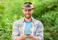 Muscular ranch man in cowboy hat care plants. Eco farm worker. Earth day. happy earth day. Eco living. farming and Royalty Free Stock Photo