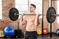 Muscular serious man doing weightlifting Royalty Free Stock Photo