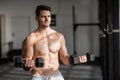 Muscular serious man doing weightlifting Royalty Free Stock Photo