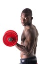 Muscular shirtless young black man exercising biceps