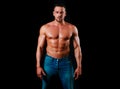 Muscular shirtless fashion male model. Strong man. Guy in vogue style on a black background. Young businessman. Athlete Royalty Free Stock Photo