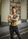 Muscular shirtless man in city centre Royalty Free Stock Photo