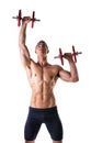 Muscular shirtless young man exercising shoulders with dumbbells Royalty Free Stock Photo