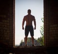 Muscular Shirtless Young Man Inside Abandoned Building. Concept of looking at the feature Royalty Free Stock Photo