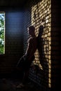 Muscular Shirtless Young Man Inside Abandoned Building. Concept of looking at the feature Royalty Free Stock Photo