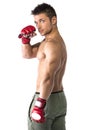 Muscular shirtless young man with mixed martial arts gloves (MMA)