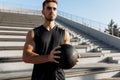 Muscular sporty man doing exercises with a ball, fitness with a ball outdoors, sport Royalty Free Stock Photo