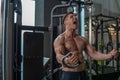 Muscular And Strong Man Workout His Chest And Shoulders In The Gym