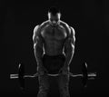 Muscular strong men, athlete, bodybuilder, weightlifter does exercises for top and arms, working out with barbell Royalty Free Stock Photo