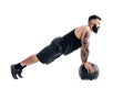 Muscular tattooed bearded male exercising fitness weights Medici Royalty Free Stock Photo