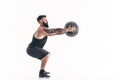 Muscular tattooed bearded male exercising fitness weights Medici Royalty Free Stock Photo