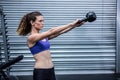 Muscular woman exercising with kettlebell Royalty Free Stock Photo