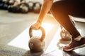 Woman standing on knee and preparing for cross fit exercise Royalty Free Stock Photo