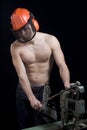 Muscular worker with helmet