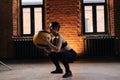 Muscular young athletic woman with beautiful strong body wearing sportswear doing squats with medicine ball during Royalty Free Stock Photo