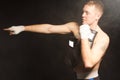 Muscular young boxer pointing his hand Royalty Free Stock Photo