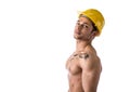 Muscular young construction worker shirtless