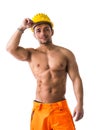 Muscular young construction worker shirtless smiling Royalty Free Stock Photo