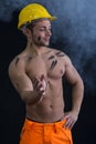 Muscular young construction worker shirtless with smoke around Royalty Free Stock Photo