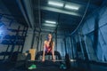 Muscular young fitness woman lifting a weight crossfit in the gym. Fitness woman deadlift barbell. Crossfit woman Royalty Free Stock Photo