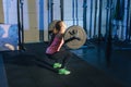 Muscular young fitness woman lifting a weight crossfit in the gym. Fitness woman deadlift barbell. Crossfit woman Royalty Free Stock Photo